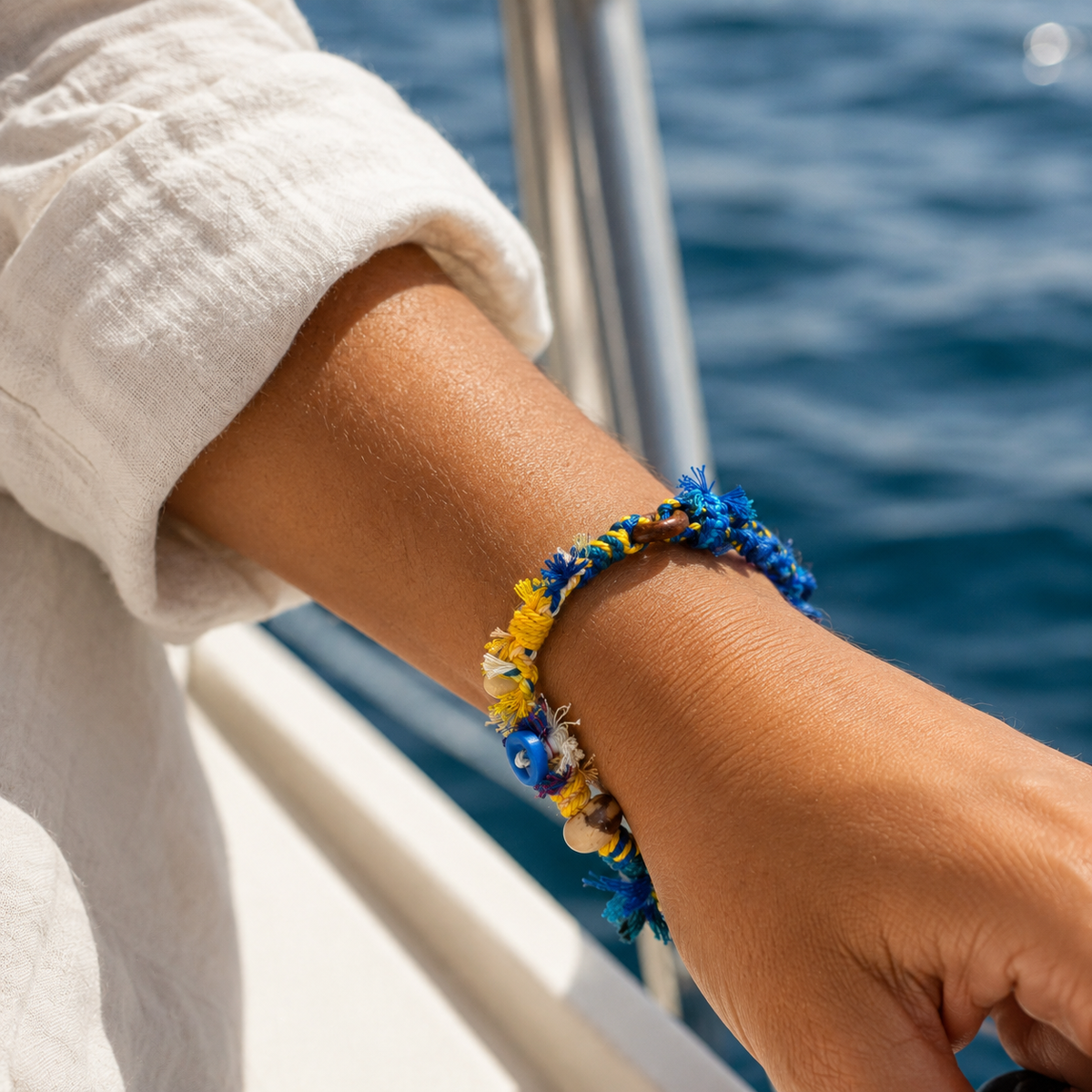 AI-generated styling illustration of the Blue Horizon blue and yellow bracelet worn on a wrist.