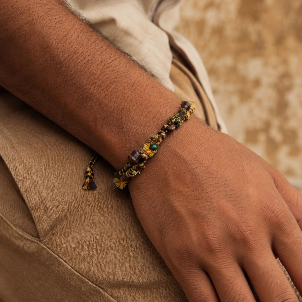 AI-generated styling illustration of the Earthbound brown, mustard and olive bracelet worn on a wrist.