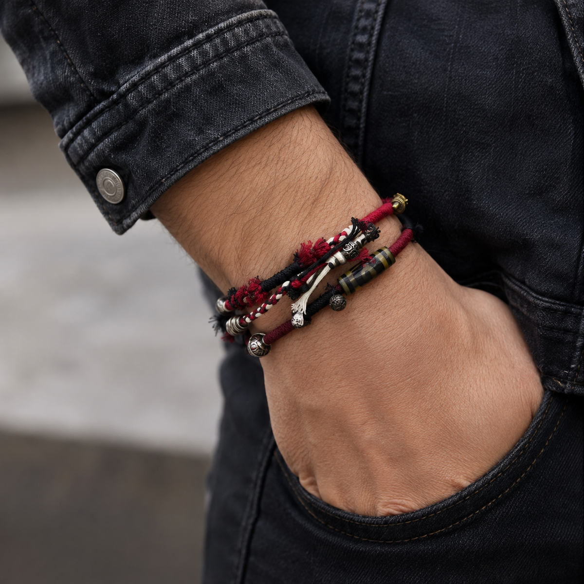 AI-generated styling illustration of the Ember Trail red, black and white bracelet worn on a wrist.