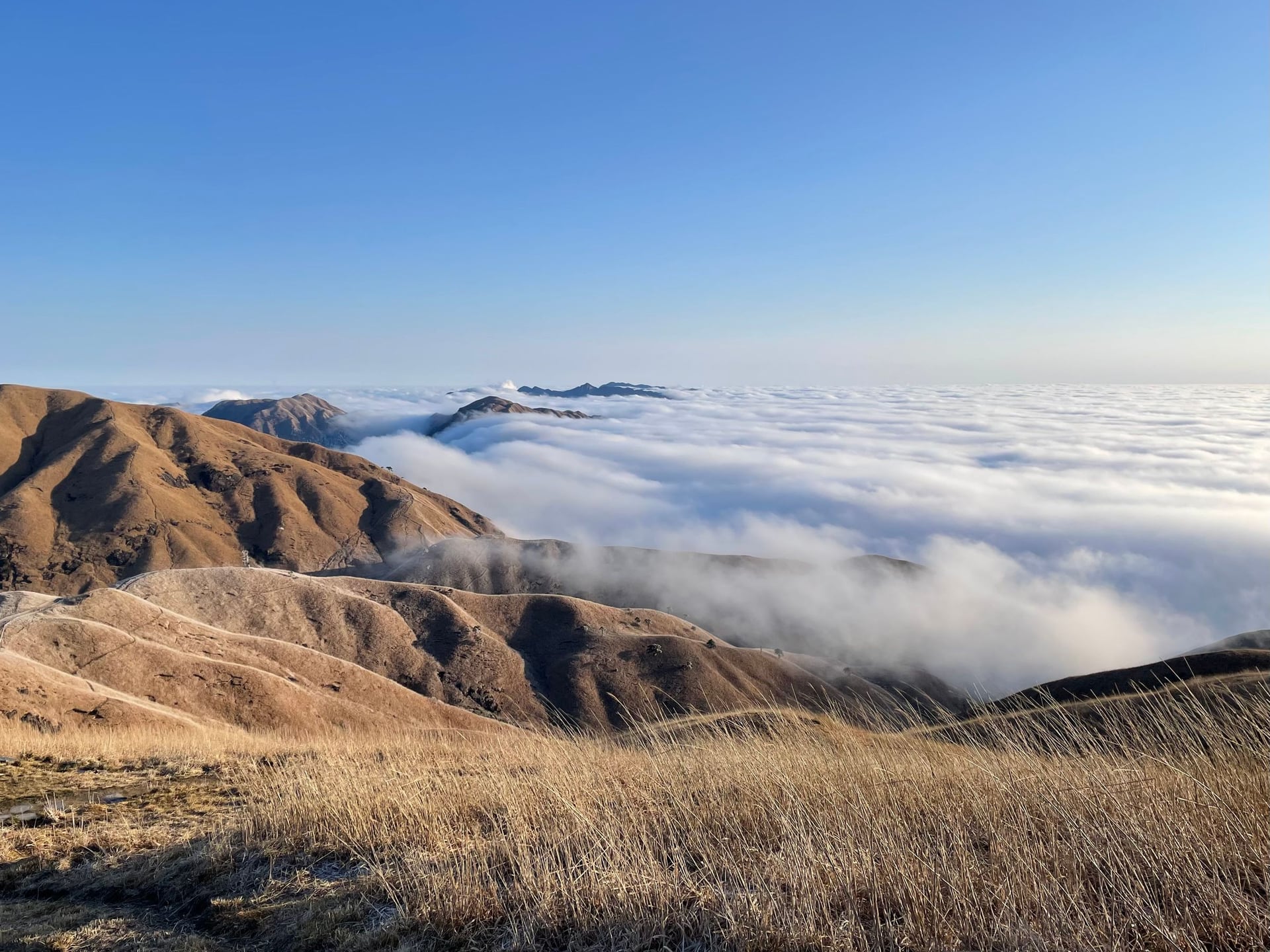 Mountain ridge above a sea of clouds